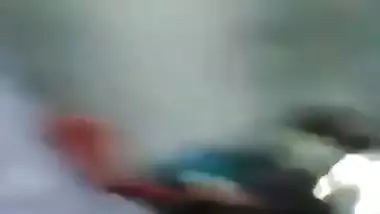 Young village girl taking carrot